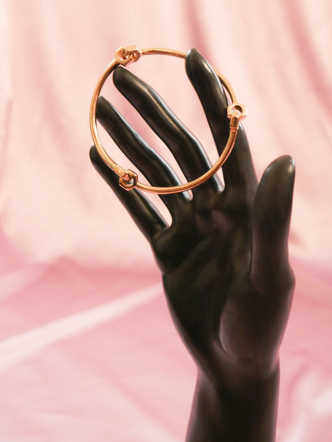 gold bracelet cuff women's accessory on black mannequin hand