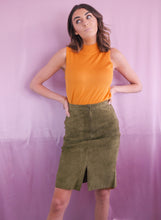 Load image into Gallery viewer, woman wearing 1980&#39;s green suede pencil skirt and vintage orange turtleneck women&#39;s clothing
