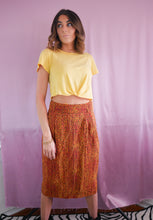 Load image into Gallery viewer, woman wearing 1980&#39;s orange and green silk high waisted skirt and yellow tshirt women&#39;s clothing
