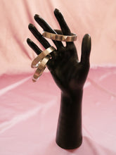 Load image into Gallery viewer, silver stud bracelet women&#39;s jewelry on a black mannequin hand
