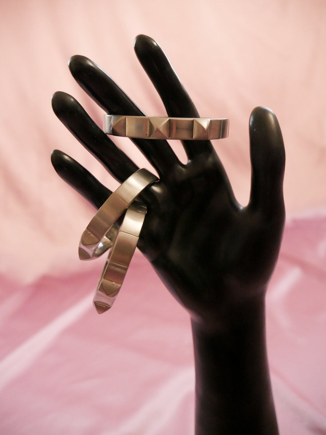silver stud bracelet women's jewelry on a black mannequin hand
