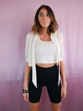 Load image into Gallery viewer, woman wearing 1950&#39;s vintage white cropped blouse, pearls and black biker shorts women&#39;s clothing
